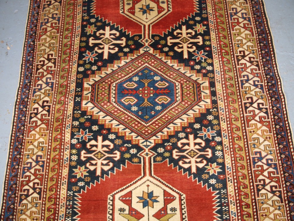 ANTIQUE CAUCASIAN RUG, SHIRVAN MEDALLION DESIGN, CIRCA 1890. View IV