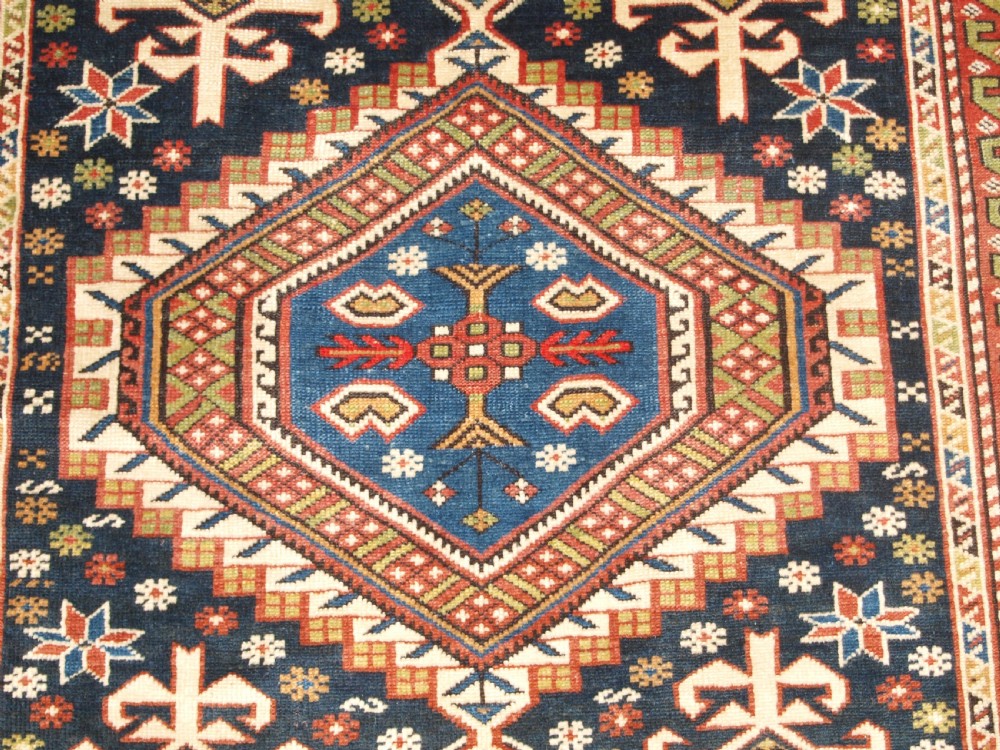 ANTIQUE CAUCASIAN RUG, SHIRVAN MEDALLION DESIGN, CIRCA 1890. View IX