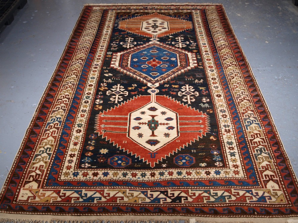 ANTIQUE CAUCASIAN SHIRVAN MEDALLION RUG OF LARGE SIZE, CIRCA 1890.