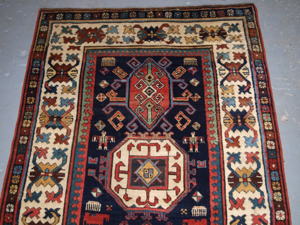 ANTIQUE CAUCASIAN GENDJE KAZAK RUNNER WITH MEDALLION DESIGN, CIRCA 1890. View III