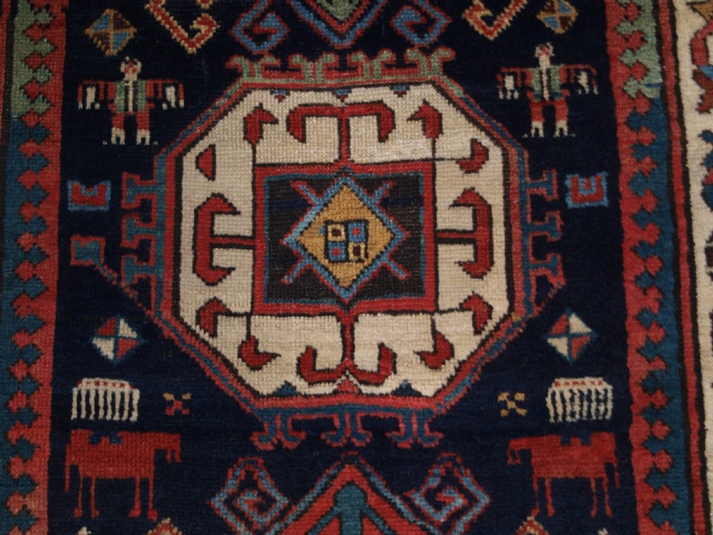 ANTIQUE CAUCASIAN GENDJE KAZAK RUNNER WITH MEDALLION DESIGN, CIRCA 1890. View VIII