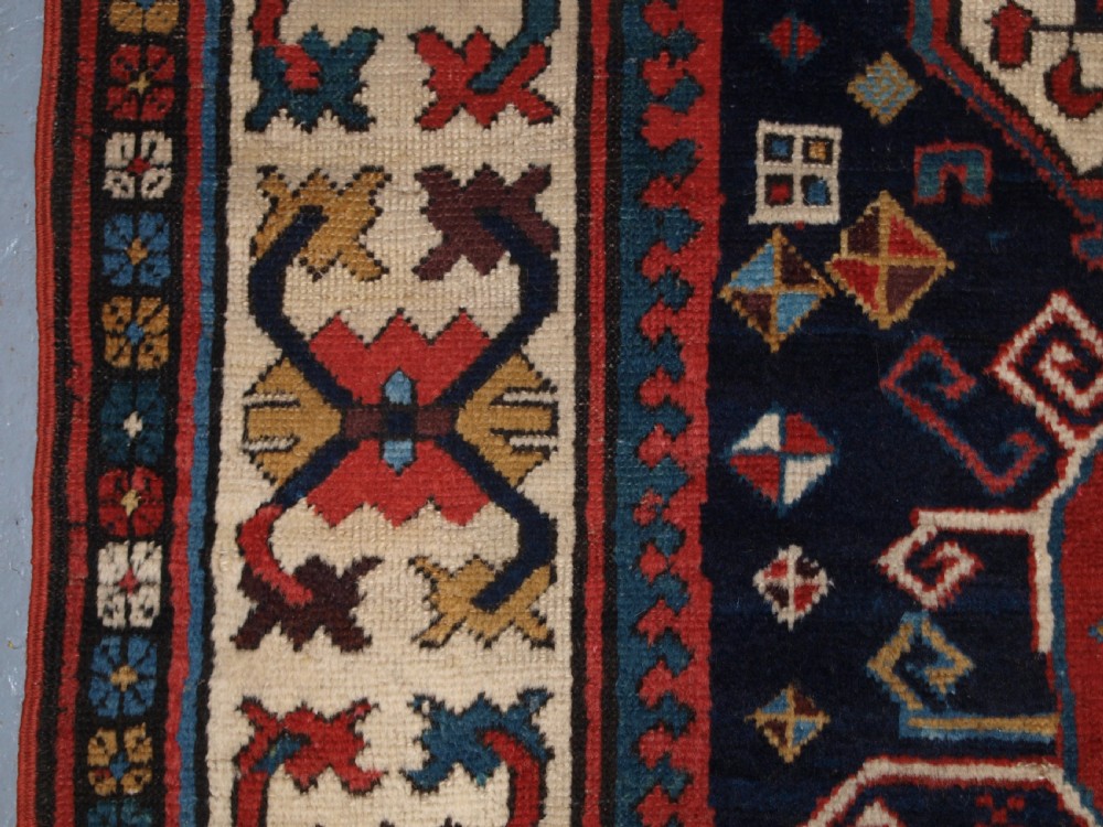 ANTIQUE CAUCASIAN GENDJE KAZAK RUNNER WITH MEDALLION DESIGN, CIRCA 1890. View IX