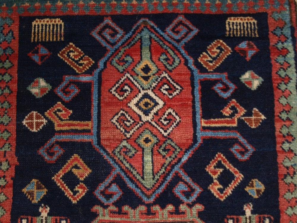 ANTIQUE CAUCASIAN GENDJE KAZAK RUNNER WITH MEDALLION DESIGN, CIRCA 1890. View X