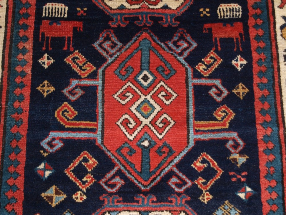 ANTIQUE CAUCASIAN GENDJE KAZAK RUNNER WITH MEDALLION DESIGN, CIRCA 1890. View XI
