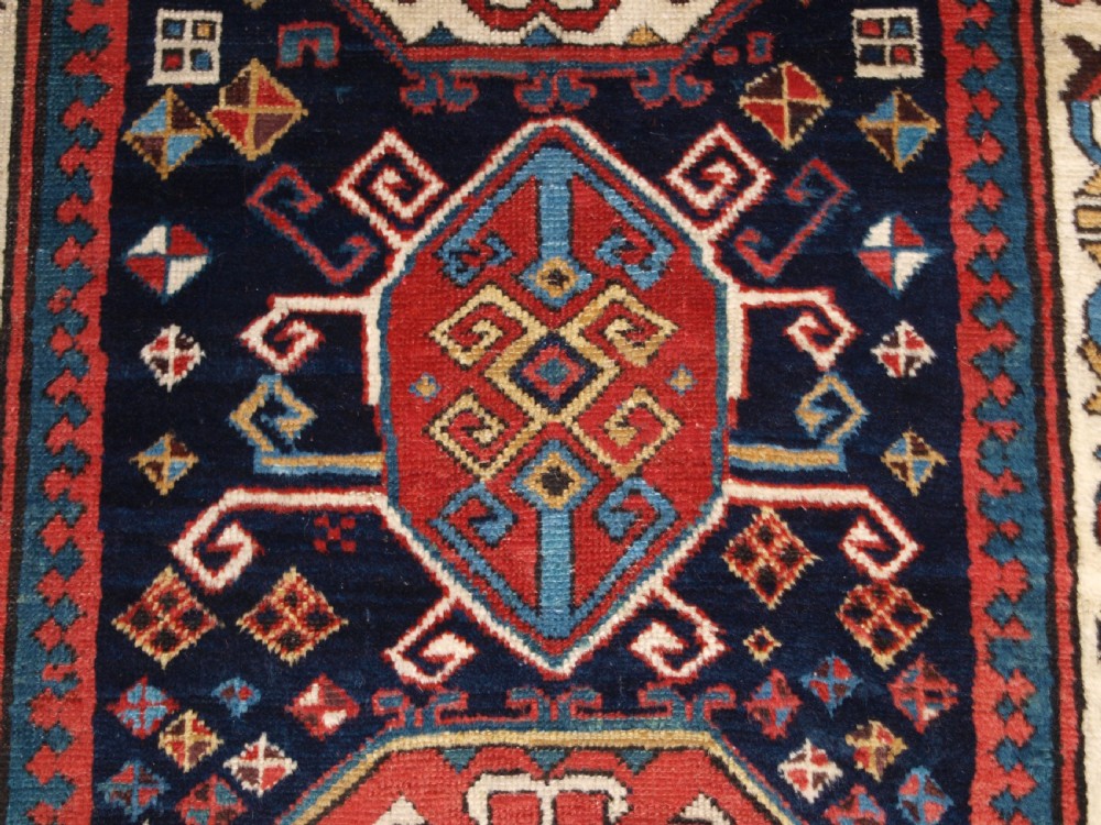 ANTIQUE CAUCASIAN GENDJE KAZAK RUNNER WITH MEDALLION DESIGN, CIRCA 1890. View XII