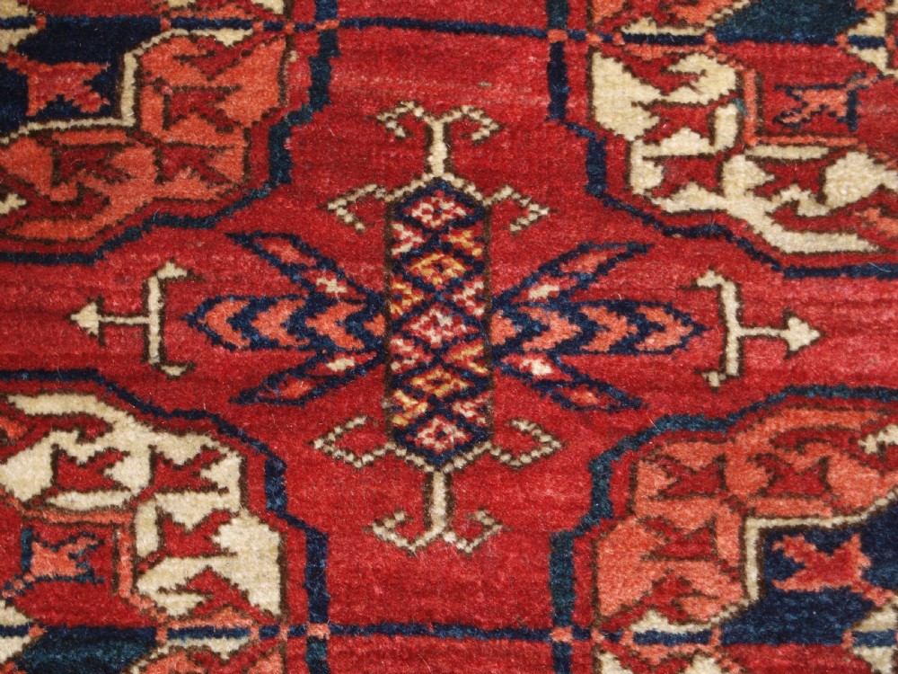 ANTIQUE TEKKE TURKMEN MAIN CARPET, LARGE ROUND GULS, CIRCA 1880. View IX