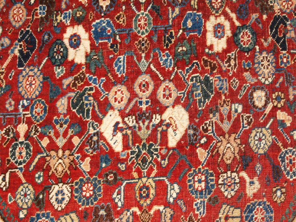 An antique hand-knotted Qashqai Kashkuli wool rug featuring a central red diamond medallion framed by complex floral motifs and multi-band geometric borders. View XII