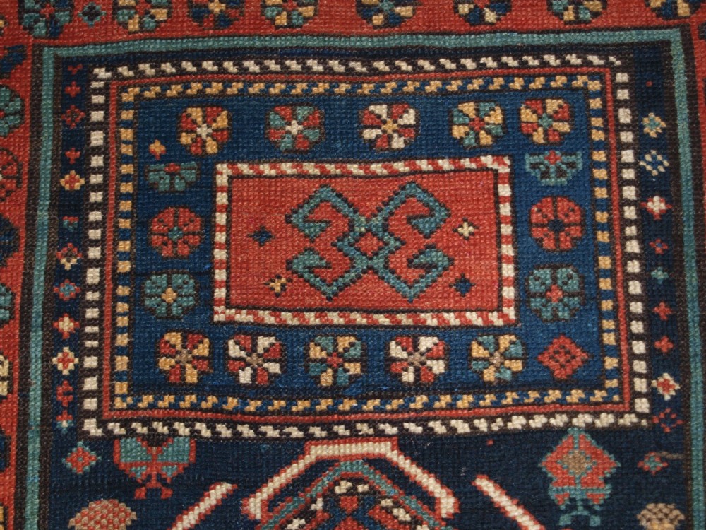 An antique hand-knotted wool Kelardasht runner rug featuring geometric medallions in dark blue, terracotta red, and cream with multi-layered patterned borders. View VIII