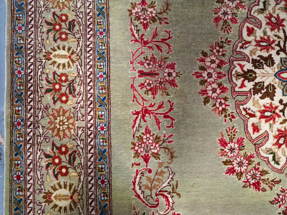 ANTIQUE TURKISH HEREKE WOOL RUG WITH SCARCE GREEN GROUND, CIRCA 1900/20. View VI