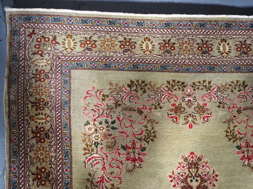 ANTIQUE TURKISH HEREKE WOOL RUG WITH SCARCE GREEN GROUND, CIRCA 1900/20. View VII