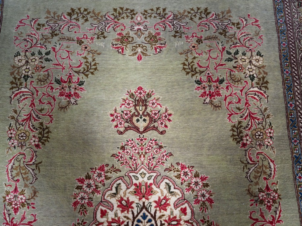 ANTIQUE TURKISH HEREKE WOOL RUG WITH SCARCE GREEN GROUND, CIRCA 1900/20. View VIII