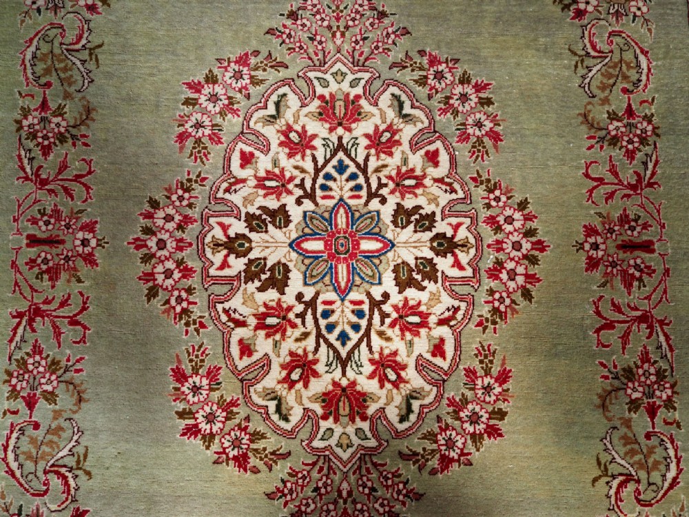 ANTIQUE TURKISH HEREKE WOOL RUG WITH SCARCE GREEN GROUND, CIRCA 1900/20. View IX