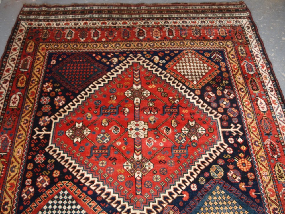ANTIQUE KELLEH LONG RUG BY THE LURI TRIBE, CLASSIC MEDALLION DESIGN, CIRCA 1900. View II