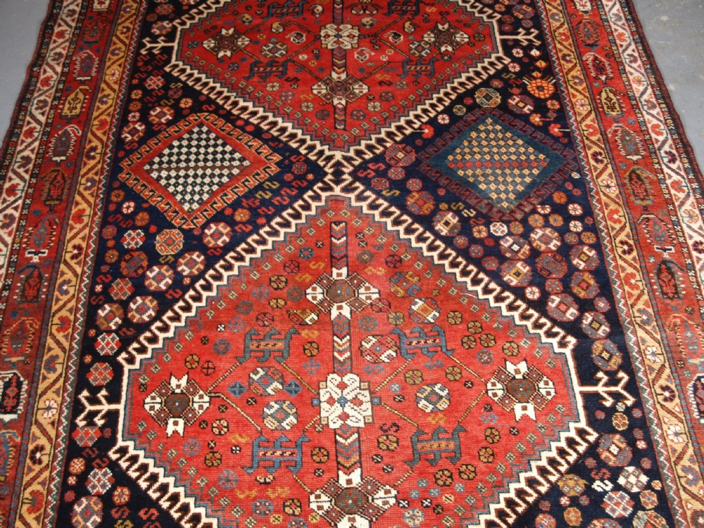 ANTIQUE KELLEH LONG RUG BY THE LURI TRIBE, CLASSIC MEDALLION DESIGN, CIRCA 1900. View III