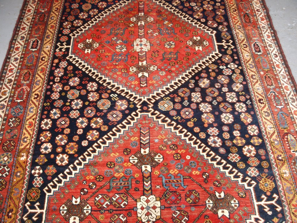 ANTIQUE KELLEH LONG RUG BY THE LURI TRIBE, CLASSIC MEDALLION DESIGN, CIRCA 1900. View IV