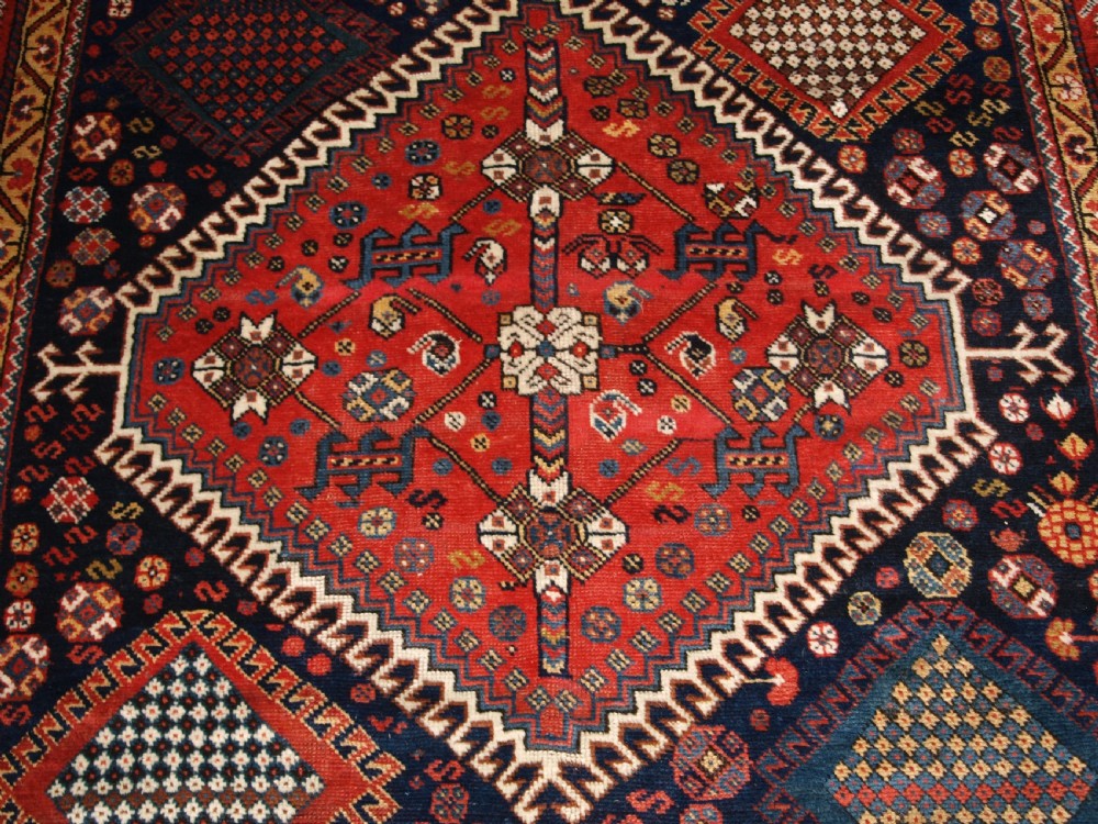 ANTIQUE KELLEH LONG RUG BY THE LURI TRIBE, CLASSIC MEDALLION DESIGN, CIRCA 1900. View VIII
