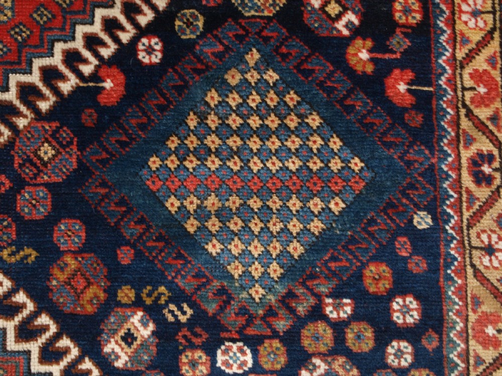 ANTIQUE KELLEH LONG RUG BY THE LURI TRIBE, CLASSIC MEDALLION DESIGN, CIRCA 1900. View IX