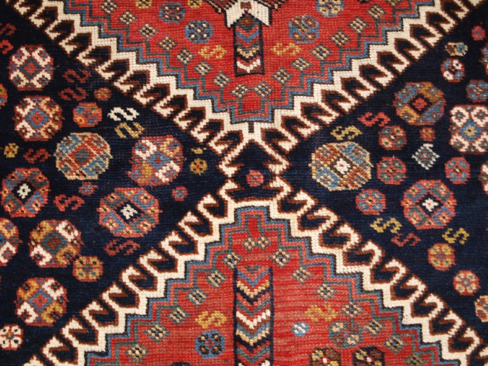 ANTIQUE KELLEH LONG RUG BY THE LURI TRIBE, CLASSIC MEDALLION DESIGN, CIRCA 1900. View X