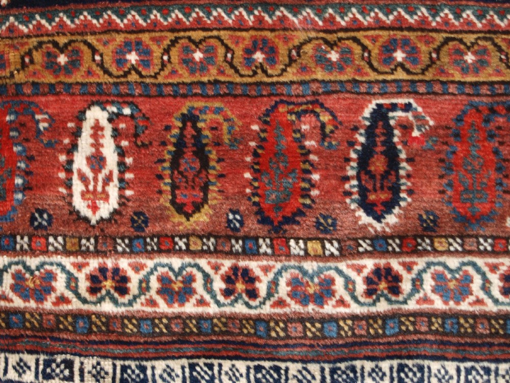 ANTIQUE KELLEH LONG RUG BY THE LURI TRIBE, CLASSIC MEDALLION DESIGN, CIRCA 1900. View XI