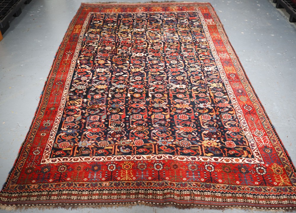 ANTIQUE TRIBAL KHAMSEH RUG WITH OUTSTANDING DESIGN AND COLOUR, CIRCA 1870.