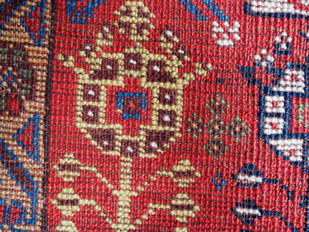 ANTIQUE TRIBAL KHAMSEH RUG WITH OUTSTANDING DESIGN AND COLOUR, CIRCA 1870. View XVI