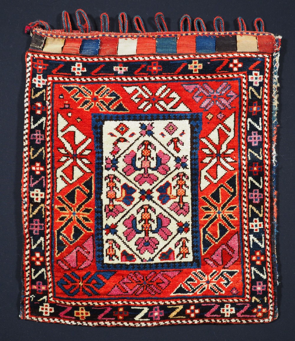ANTIQUE SOUTH CAUCASIAN BAG WITH STRIPED PLAIN WEAVE BACK, CIRCA 1900.