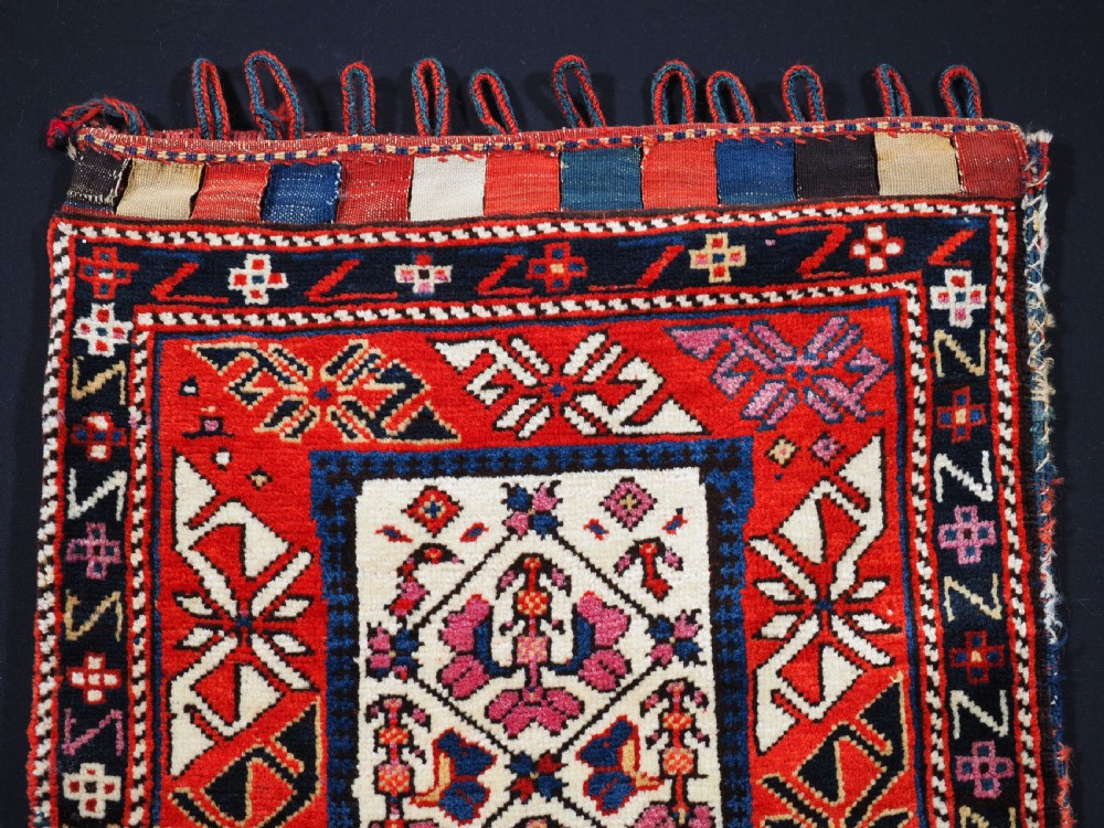 ANTIQUE SOUTH CAUCASIAN BAG WITH STRIPED PLAIN WEAVE BACK, CIRCA 1900. View II
