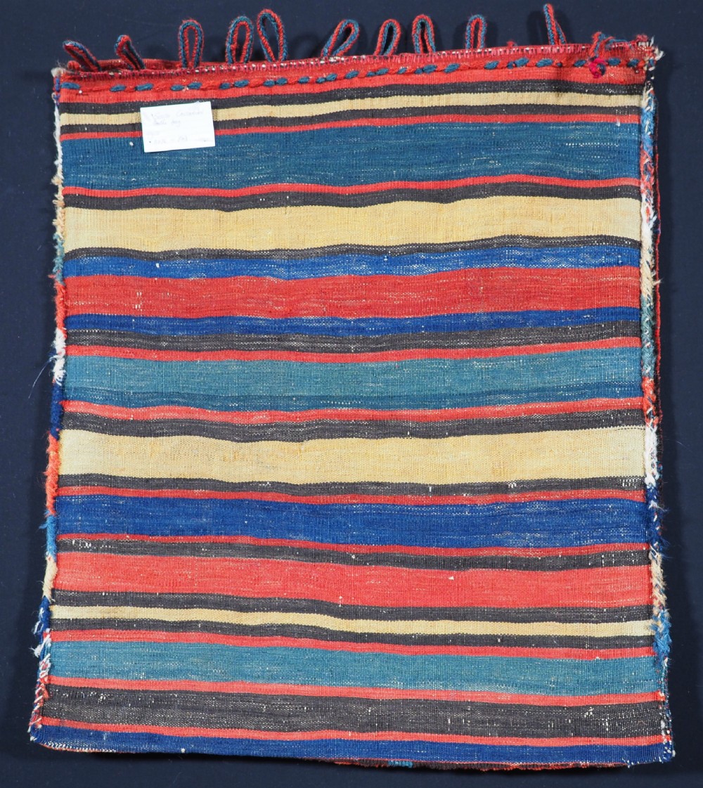 ANTIQUE SOUTH CAUCASIAN BAG WITH STRIPED PLAIN WEAVE BACK, CIRCA 1900. View V