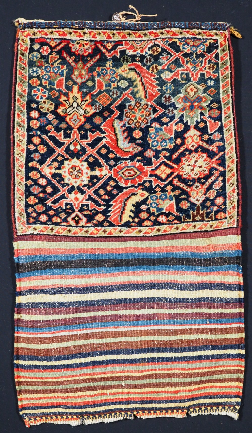 ANTIQUE TRIBAL QASHQAI BAG, HERATI DESIGN WITH STRIPED PLAIN WEAVE BACK, CIRCA 1880.