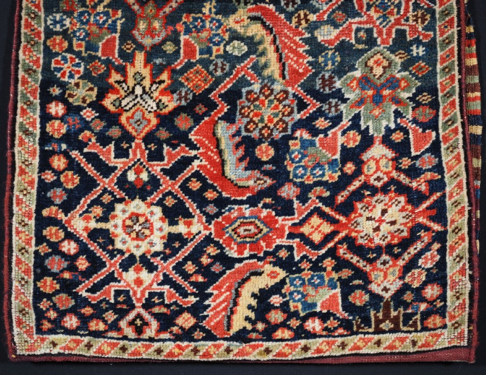 ANTIQUE TRIBAL QASHQAI BAG, HERATI DESIGN WITH STRIPED PLAIN WEAVE BACK, CIRCA 1880. View IV