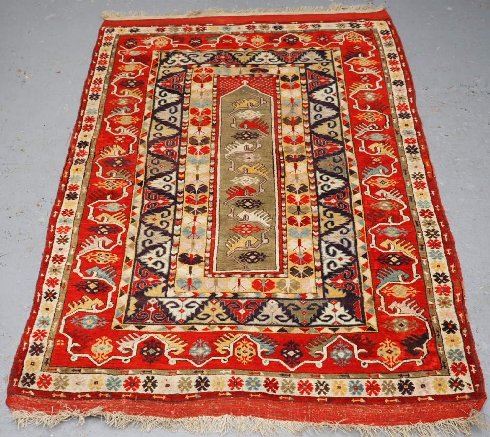ANTIQUE TURKISH MILAS RUG OF SCARCE DESIGN, SUPERB COLOUR, CIRCA 1890.