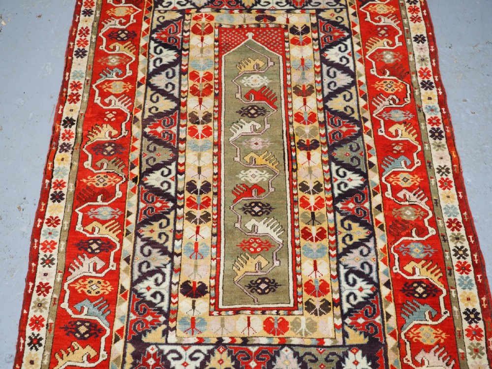 ANTIQUE TURKISH MILAS RUG OF SCARCE DESIGN, SUPERB COLOUR, CIRCA 1890. View IV