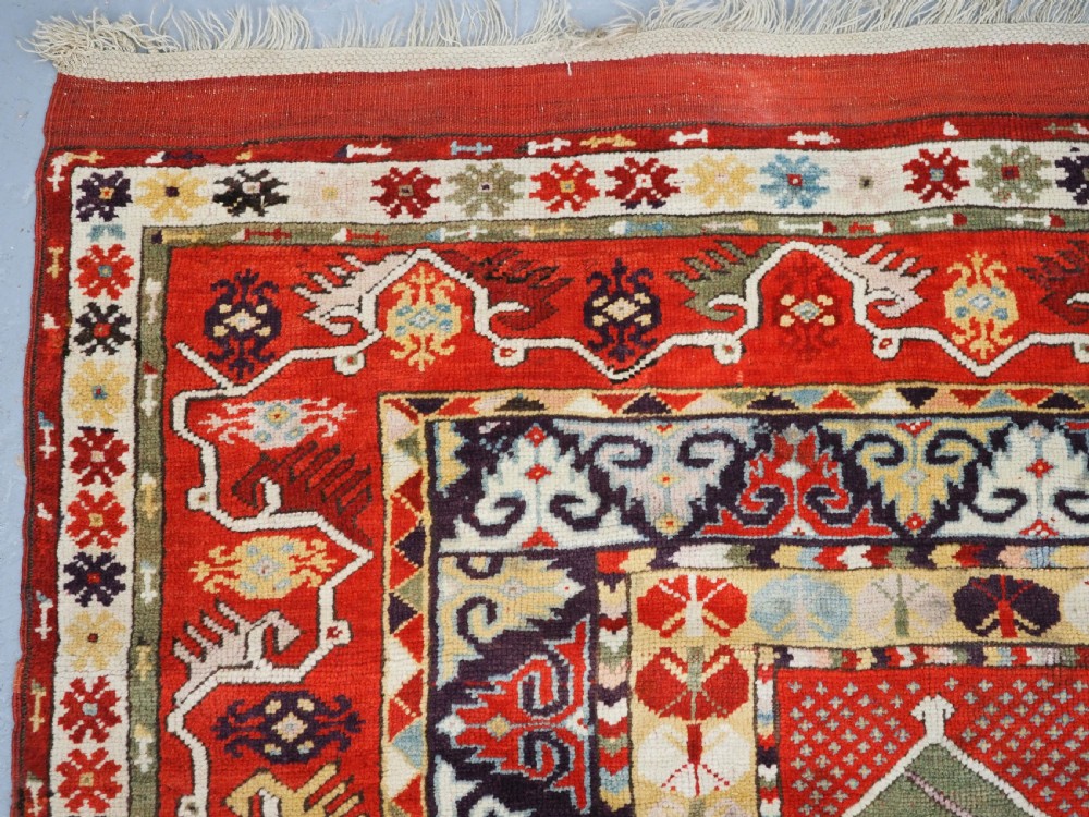ANTIQUE TURKISH MILAS RUG OF SCARCE DESIGN, SUPERB COLOUR, CIRCA 1890. View VI