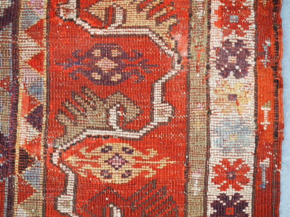ANTIQUE TURKISH MILAS RUG OF SCARCE DESIGN, SUPERB COLOUR, CIRCA 1890. View XX