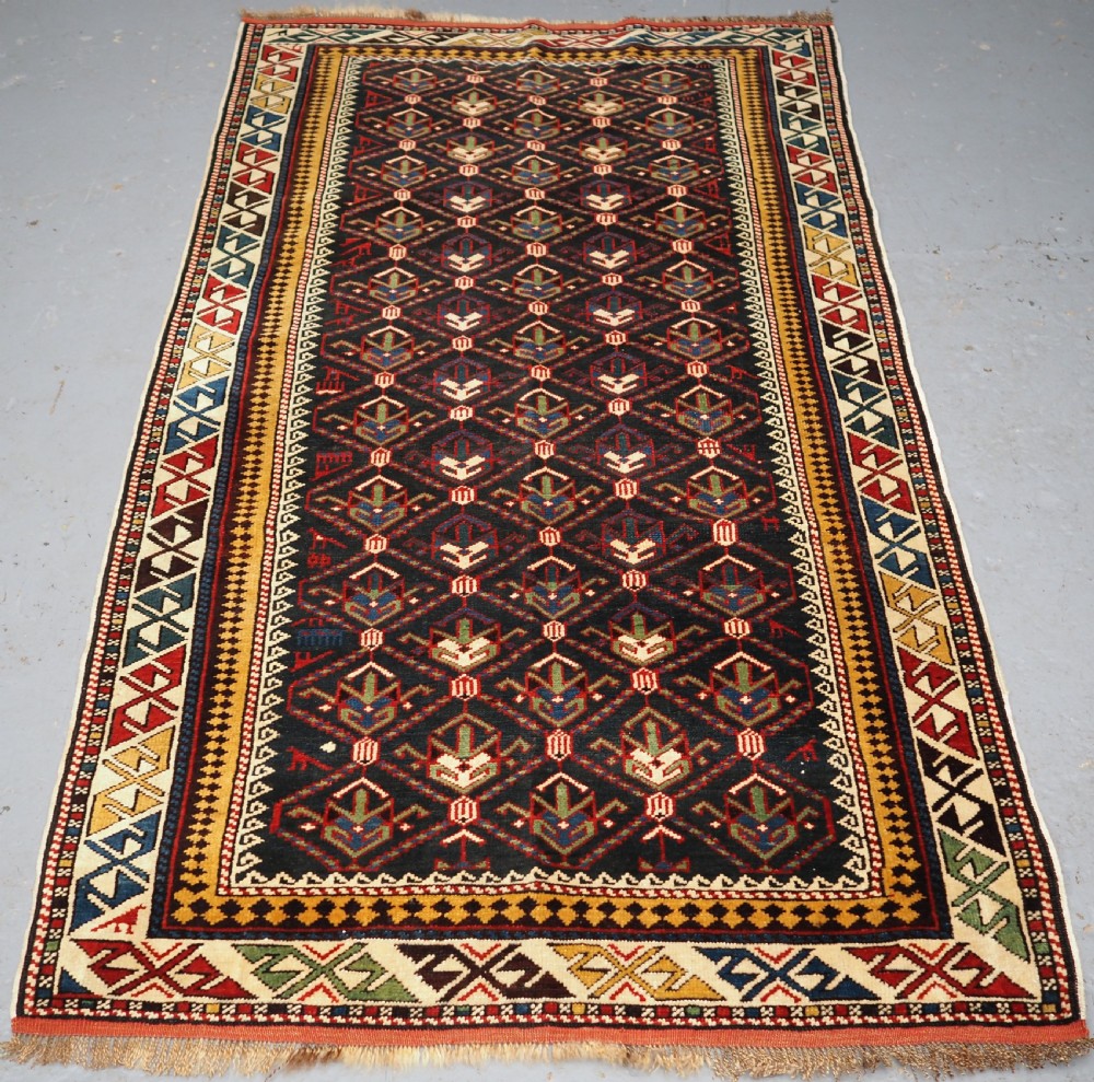ANTIQUE CAUCASIAN DAGHESTAN RUG, LATTICE DESIGN, OUTSTANDING CONDITION, CIRCA 1900.
