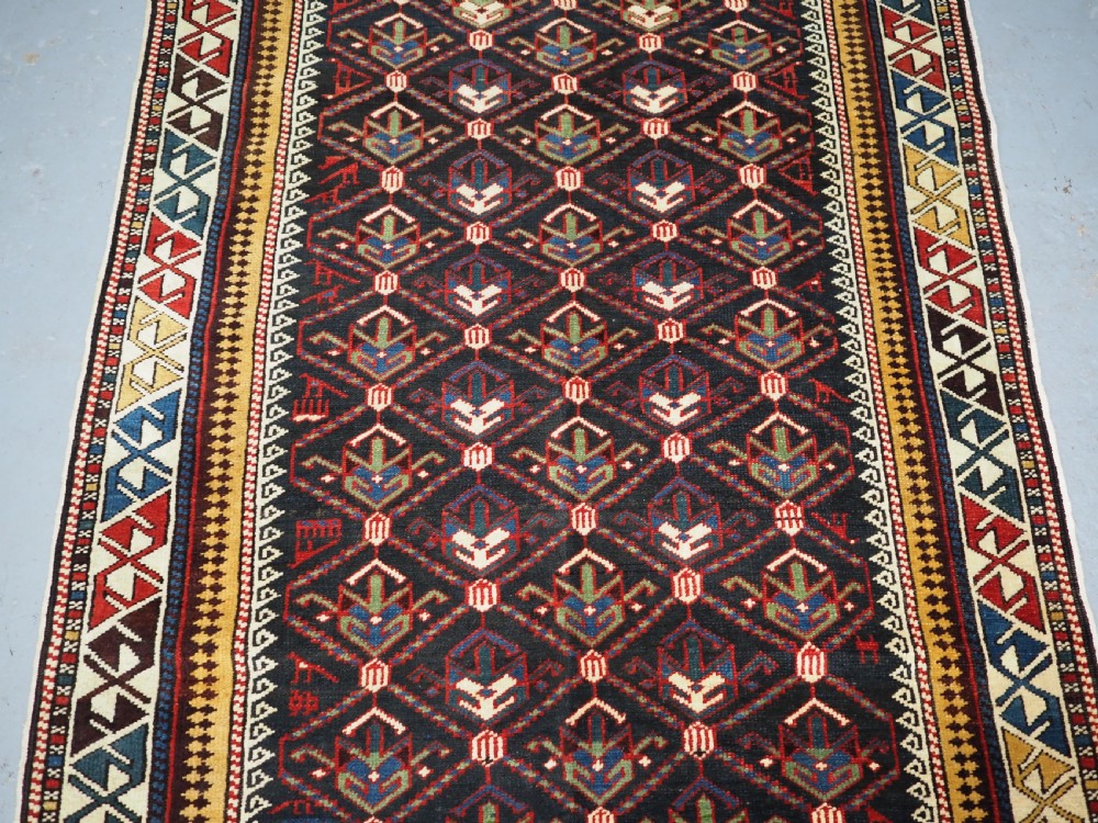 ANTIQUE CAUCASIAN DAGHESTAN RUG, LATTICE DESIGN, OUTSTANDING CONDITION, CIRCA 1900. View IV