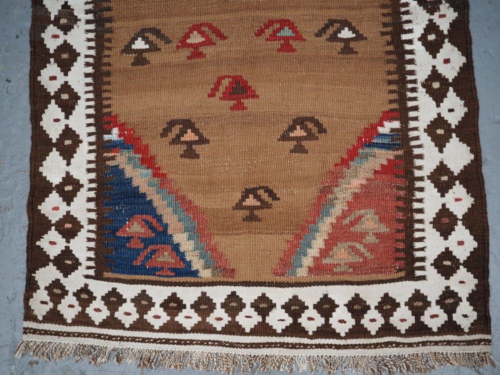 ANTIQUE SMALL TRIBAL KILIM BY THE LURI OR BAKHTIARI, CAMEL WOOL AND COTTON, CIRCA 1900. View IV