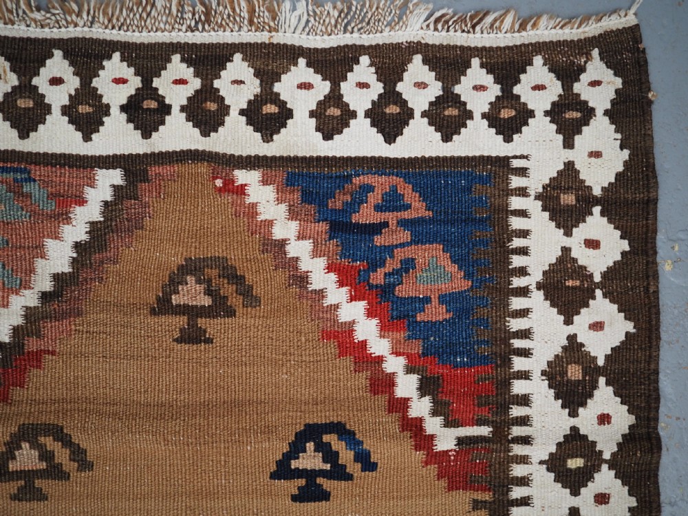 ANTIQUE SMALL TRIBAL KILIM BY THE LURI OR BAKHTIARI, CAMEL WOOL AND COTTON, CIRCA 1900. View VII
