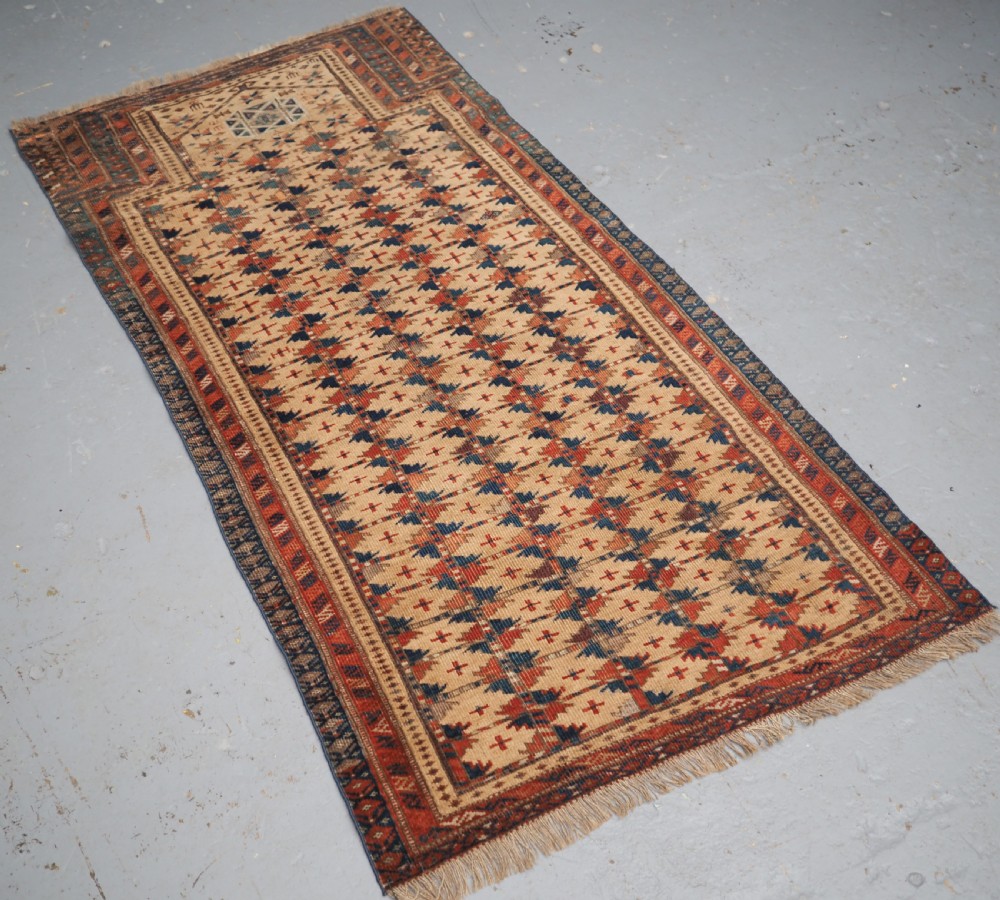 ANTIQUE PRAYER RUG BY THE ERSARI TURKMEN OF SCARCE TYPE, CIRCA 1890. View II