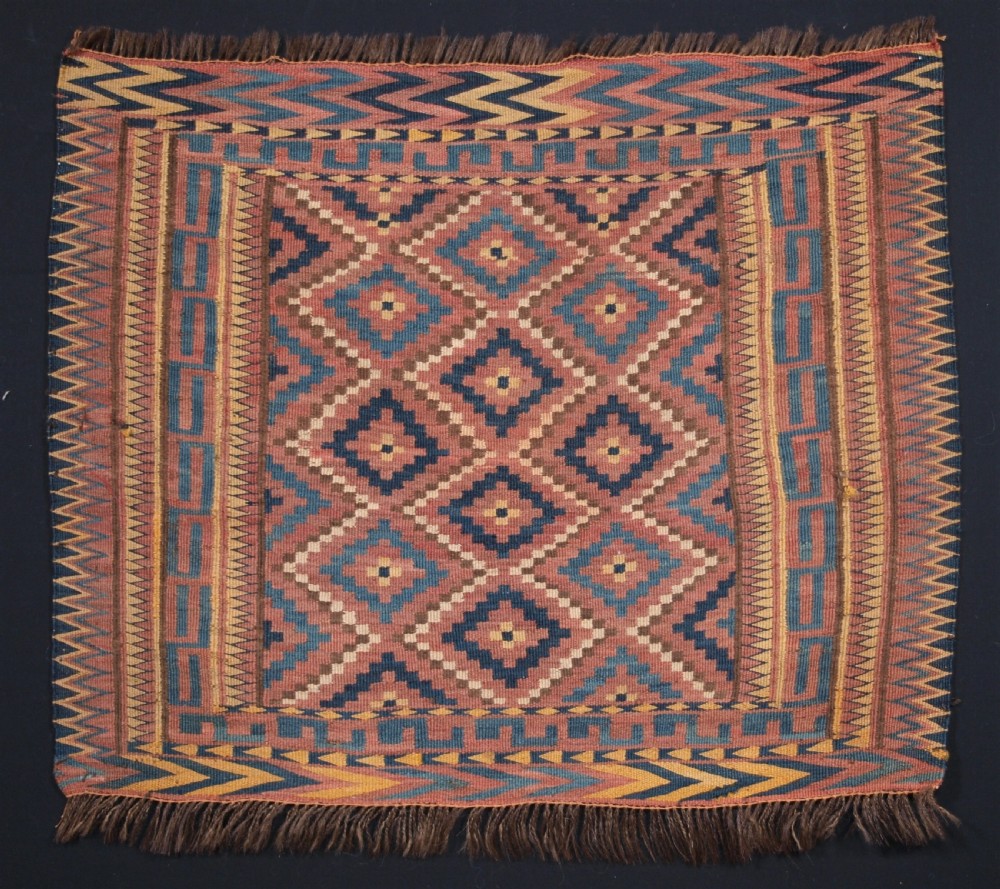 ANTIQUE UZBEK BAG FACE, PLAIN WEAVE WITH TRADITIONAL DESIGN, CIRCA 1900.