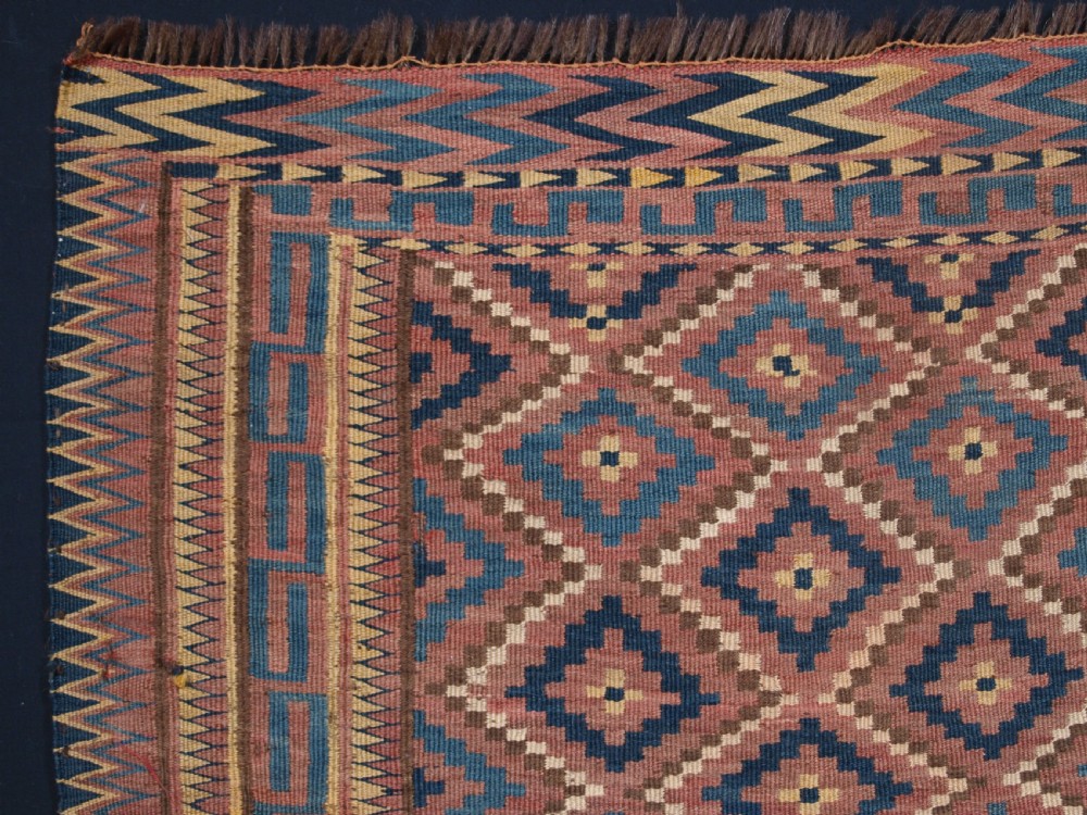 ANTIQUE UZBEK BAG FACE, PLAIN WEAVE WITH TRADITIONAL DESIGN, CIRCA 1900. View II