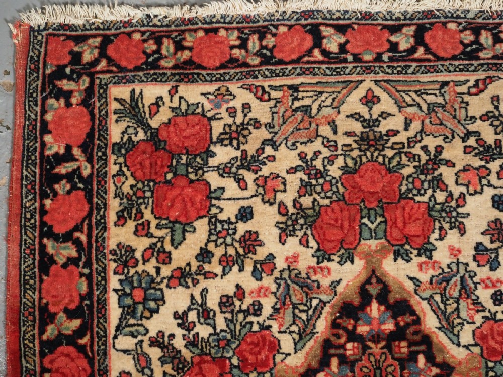 ANTIQUE BIJAR RUG OF SMALL SQUARE PUSHTI SIZE, FLORAL DESIGN, CIRCA 1890. View II