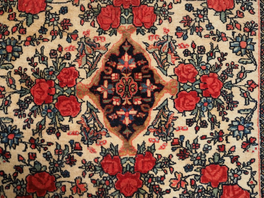 ANTIQUE BIJAR RUG OF SMALL SQUARE PUSHTI SIZE, FLORAL DESIGN, CIRCA 1890. View IV
