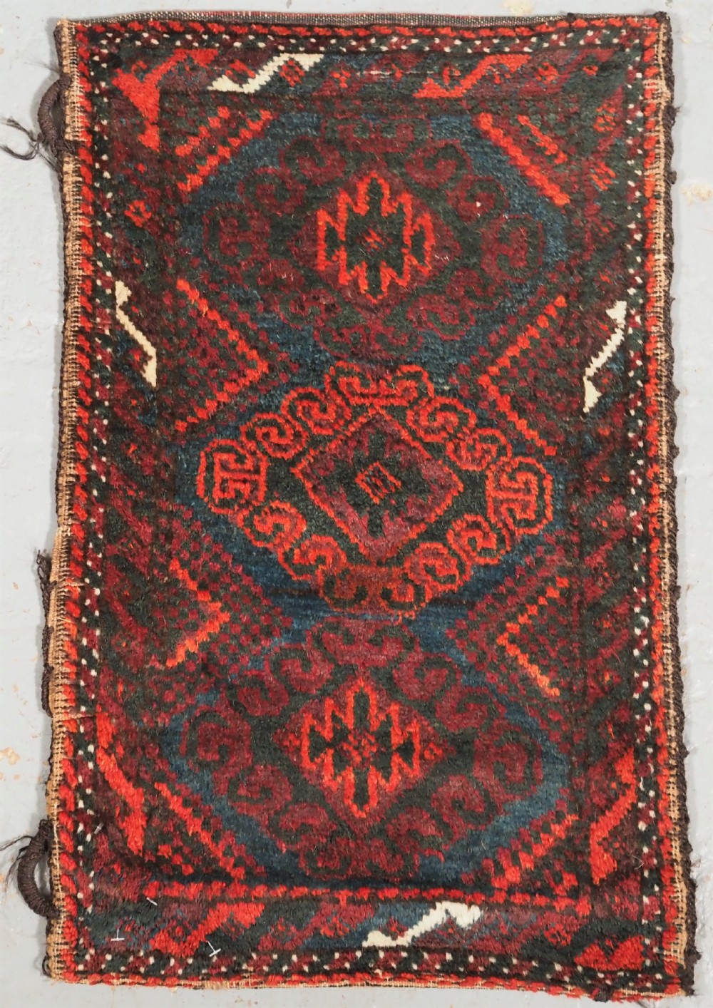 ANTIQUE MUSHWANI BALUCH PUSHTI WITH PLAIN WEAVE BACK, CIRCA 1900.