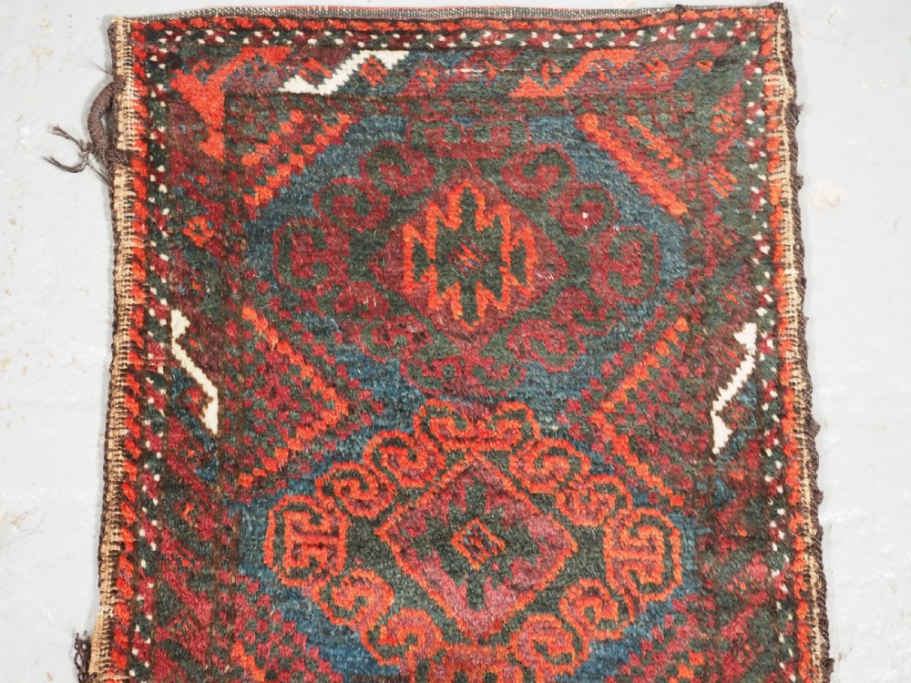 ANTIQUE MUSHWANI BALUCH PUSHTI WITH PLAIN WEAVE BACK, CIRCA 1900. View II