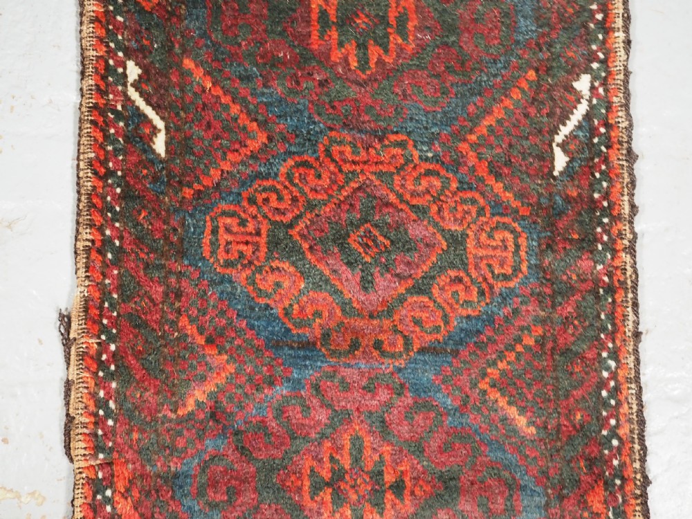 ANTIQUE MUSHWANI BALUCH PUSHTI WITH PLAIN WEAVE BACK, CIRCA 1900. View III