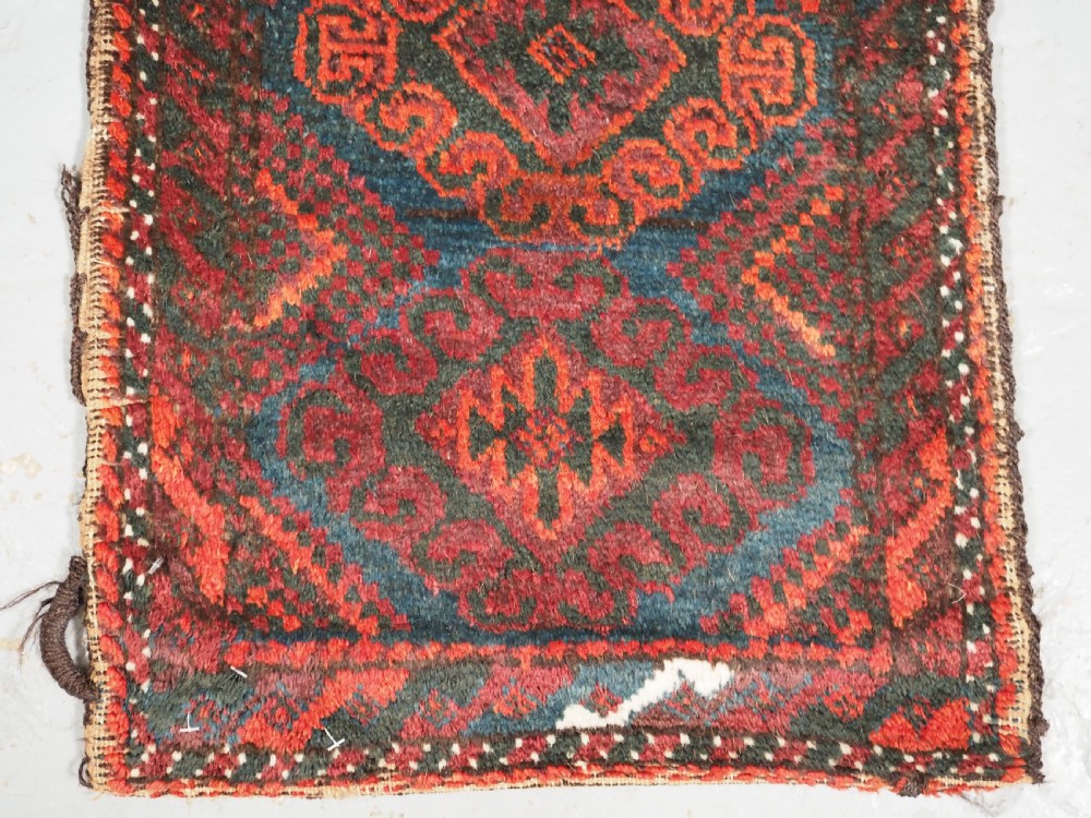 ANTIQUE MUSHWANI BALUCH PUSHTI WITH PLAIN WEAVE BACK, CIRCA 1900. View IV