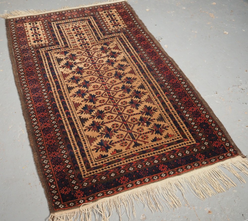 ANTIQUE BALUCH CAMEL GROUND PRAYER RUG WITH TREE OF LIFE, CIRCA 1900. View II