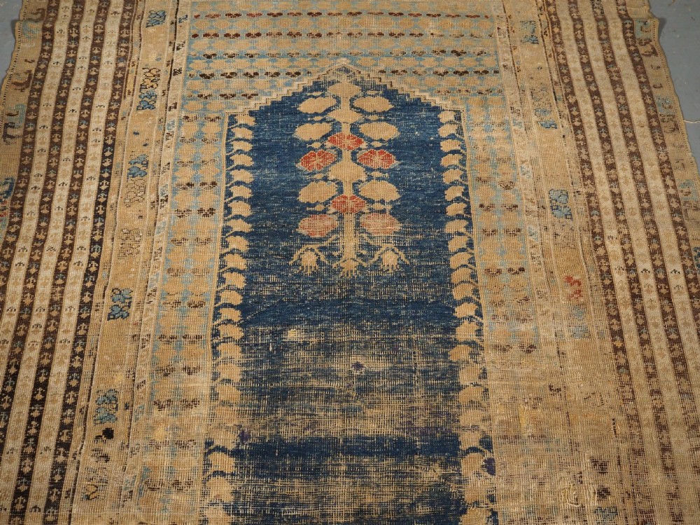 ANTIQUE TURKISH GHIORDES PRAYER RUG OF SCARCE EARLY DESIGN, 18TH CENTURY. View IV