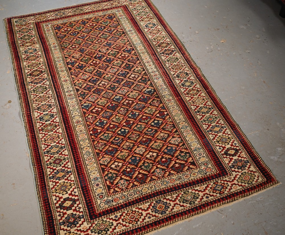 ANTIQUE CAUCASIAN KUBA SHIRVAN RUG OF FLORAL LATTICE DESIGN, CIRCA 1880. View II